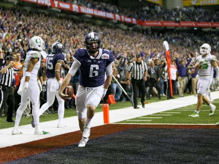 Jan 2, 2016; San Antonio, TX, USA; TCU Horned Frogs quarterback Bram Kohlhausen (6) scores the winning touchdown against the Oregon Ducks in overtime at the Valero Alamo Bowl in the Alamodome. TCU won 47-41.